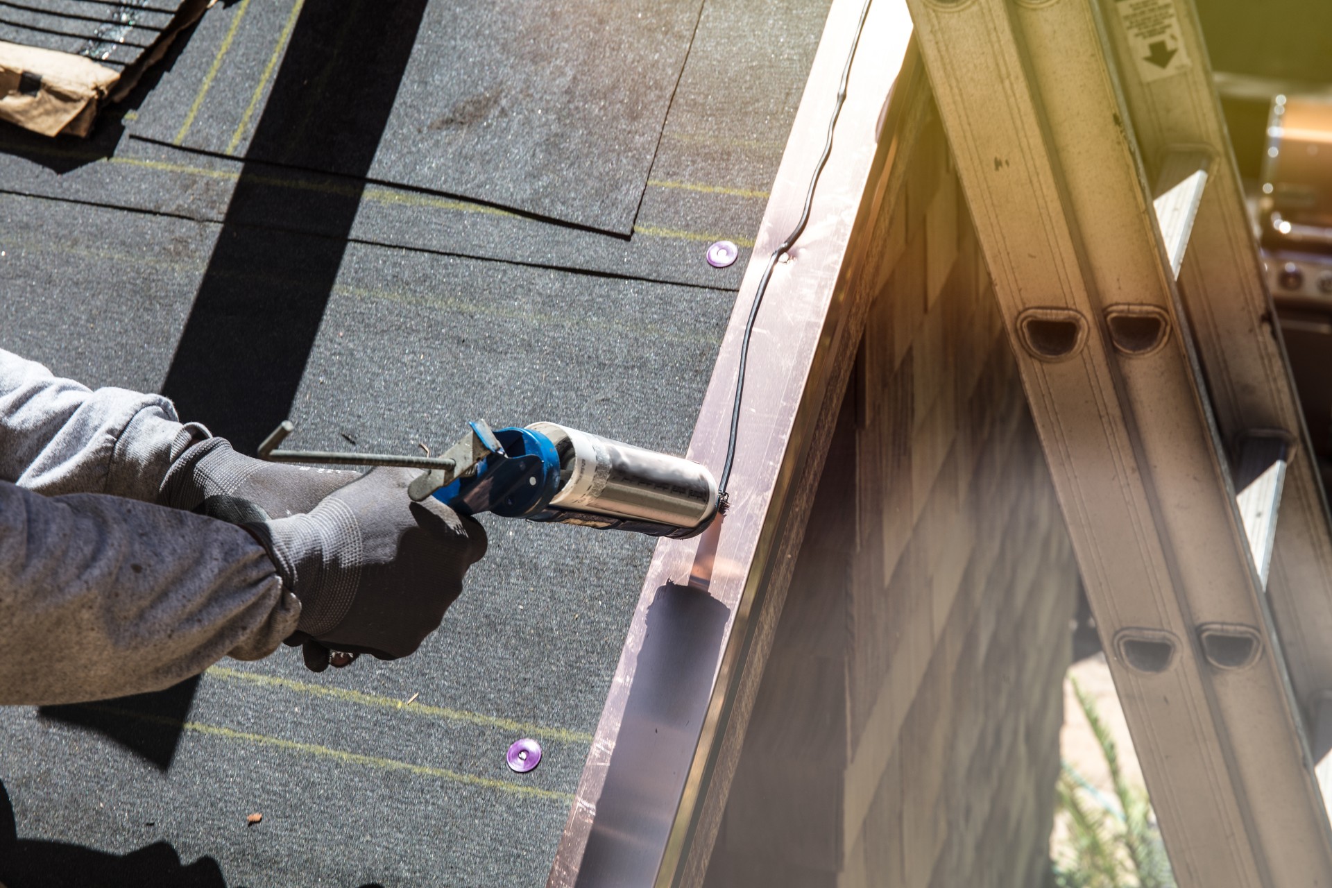 Installing new roof, Caulking.